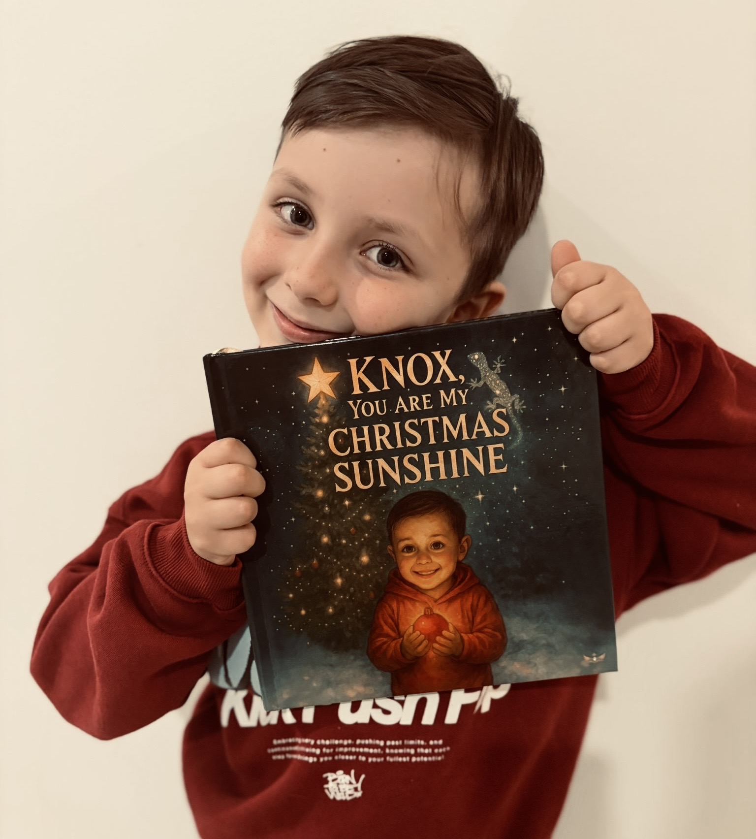 Knox holding his Monarch Tales book