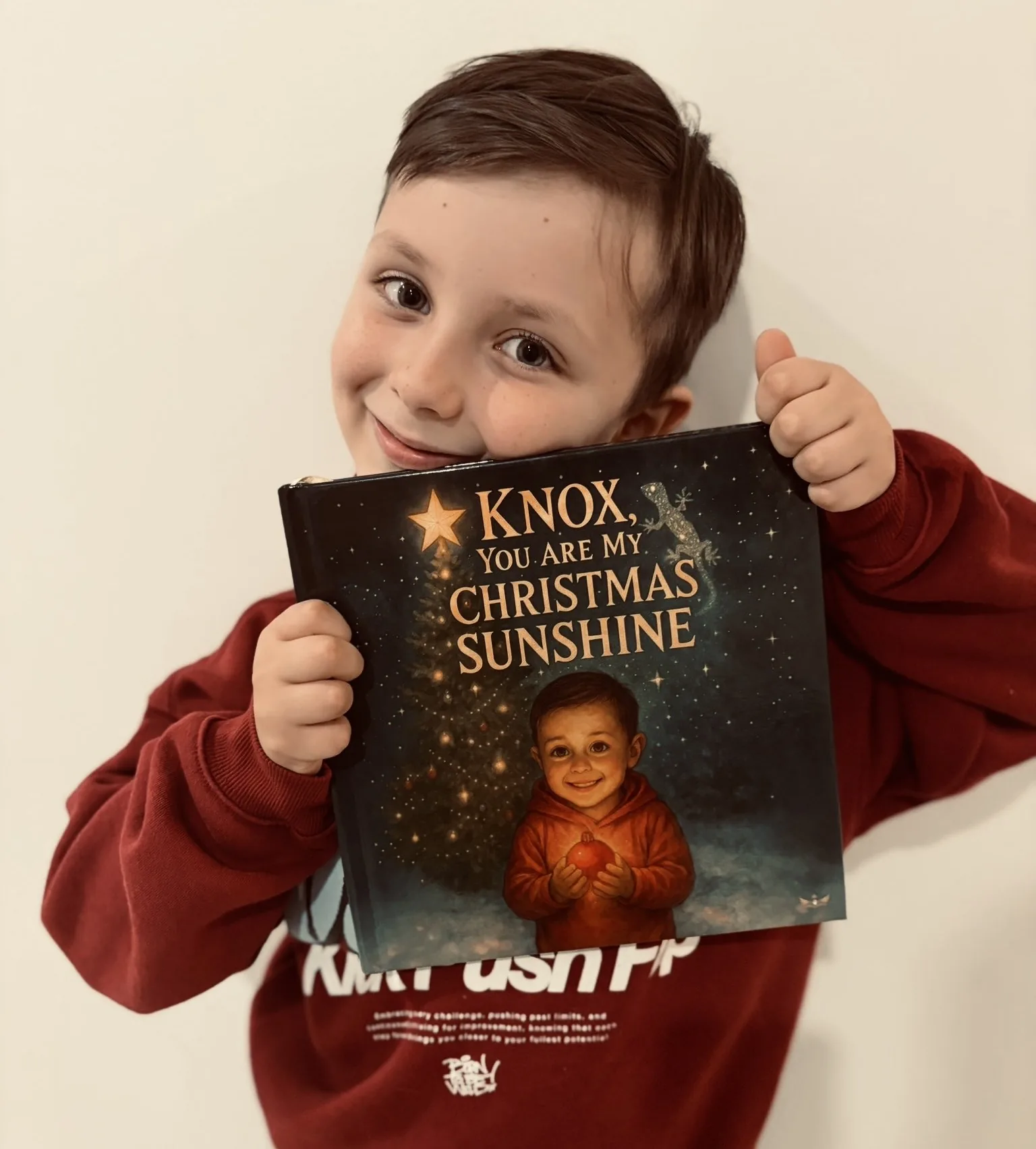 Knox holding his Monarch Tales book